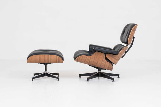 Vintage Lounge Chair und Ottoman von Charles und Ray Eames für Herman Miller, Nussbaum und Leder
