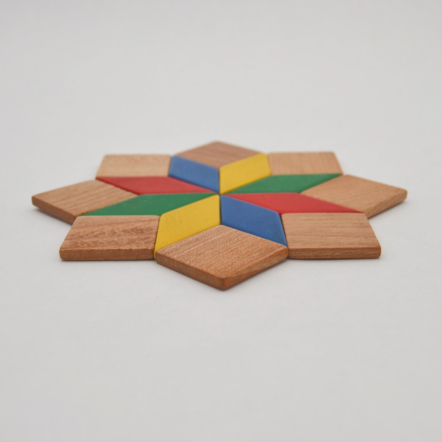 Vintage trivet star colorful made of wood