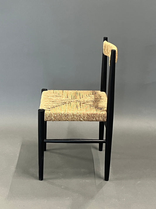 Dining chair with black frame and natural rope