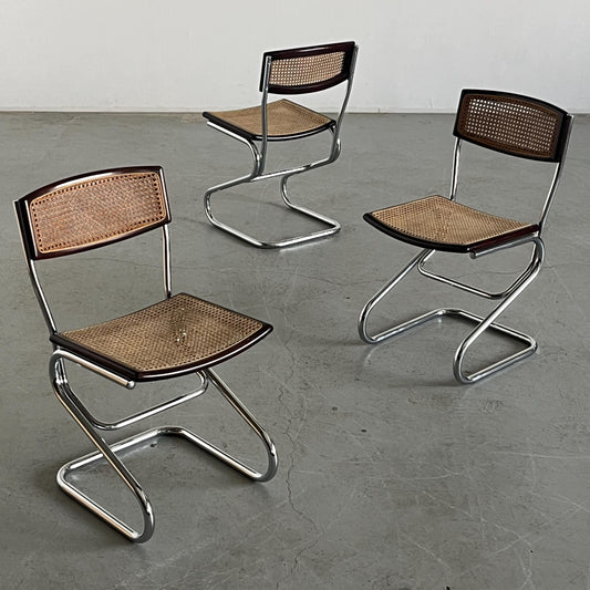 Vintage cantilever dining chair made of wood, canework, and chrome in the style of Marcel Breuer