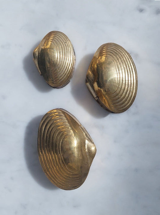 Trio of brass boxes in gold