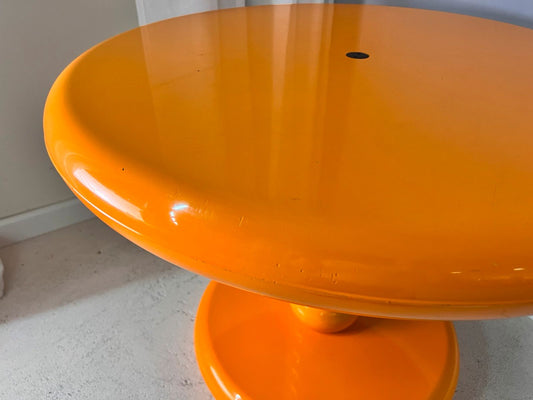 Round coffee table yellow plastic by Peter Ghyczy