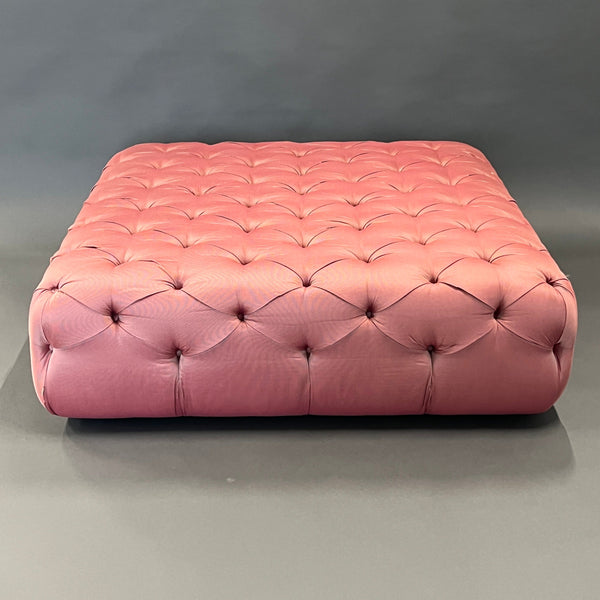 Pouf / Ottoman made of pink fabric