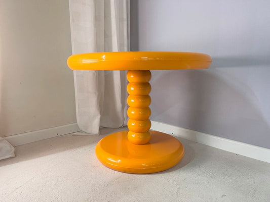 Round coffee table yellow plastic by Peter Ghyczy