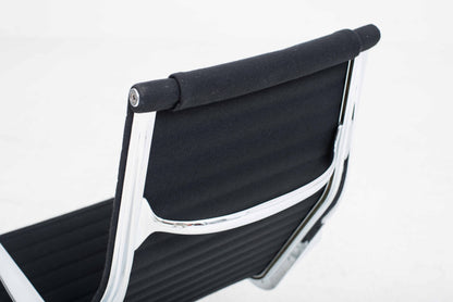 Vitra EA 124 armchair and EA 125 ottoman by Charles and Ray Eames in black Hopsak