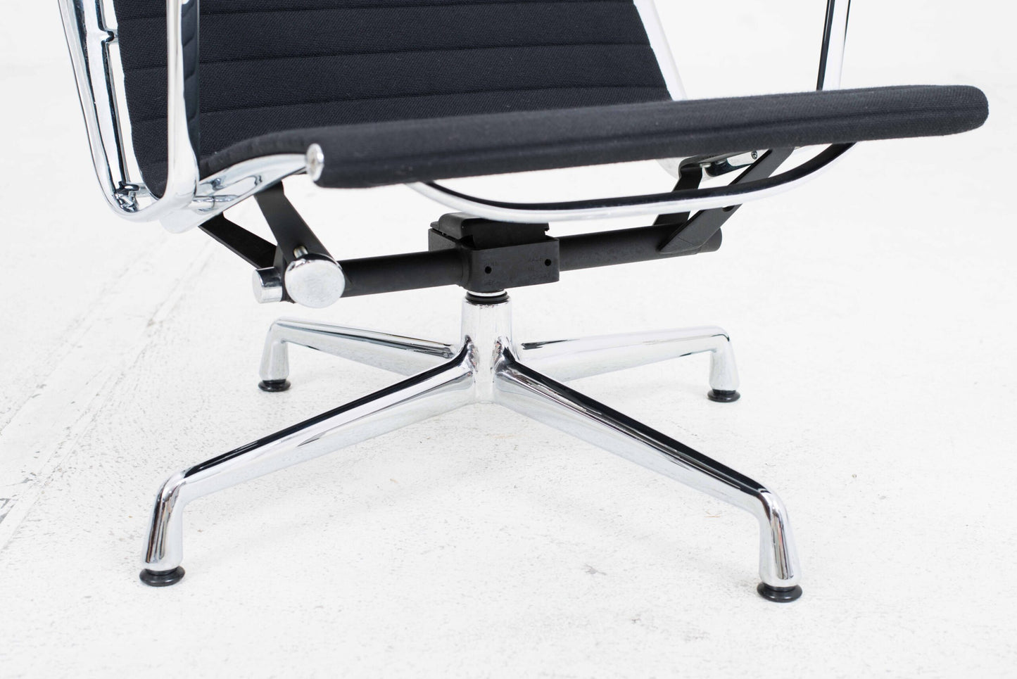 Vitra EA 124 armchair and EA 125 ottoman by Charles and Ray Eames in black Hopsak