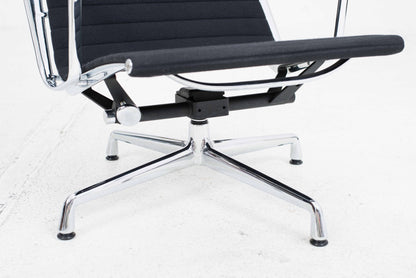 Vitra EA 124 armchair and EA 125 ottoman by Charles and Ray Eames in black Hopsak