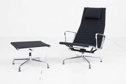 Vitra EA 124 armchair and EA 125 ottoman by Charles and Ray Eames in black Hopsak