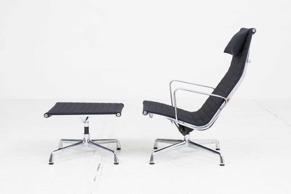 Vitra EA 124 armchair and EA 125 ottoman by Charles and Ray Eames in black Hopsak