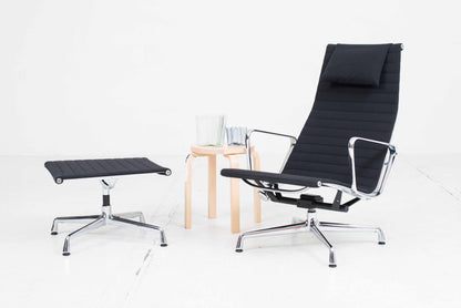 Vitra EA 124 armchair and EA 125 ottoman by Charles and Ray Eames in black Hopsak