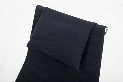 Vitra EA 124 armchair and EA 125 ottoman by Charles and Ray Eames in black Hopsak