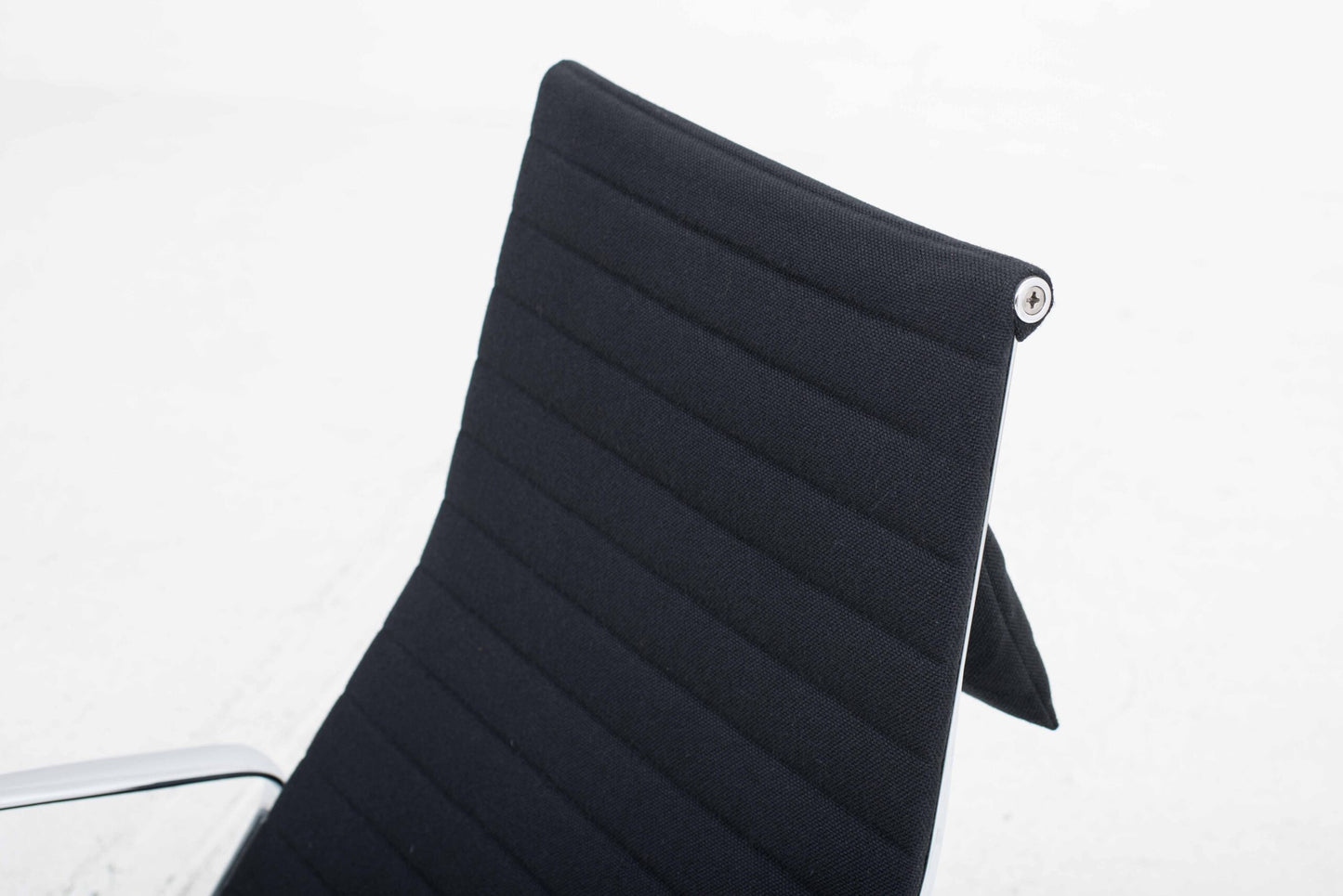 Vitra EA 124 armchair and EA 125 ottoman by Charles and Ray Eames in black Hopsak