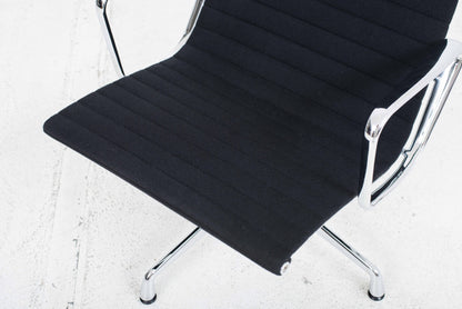 Vitra EA 124 armchair and EA 125 ottoman by Charles and Ray Eames in black Hopsak