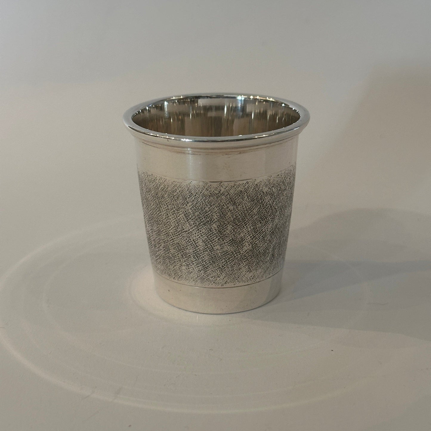 Vintage silver cup by Cartier with cross-hatch decoration