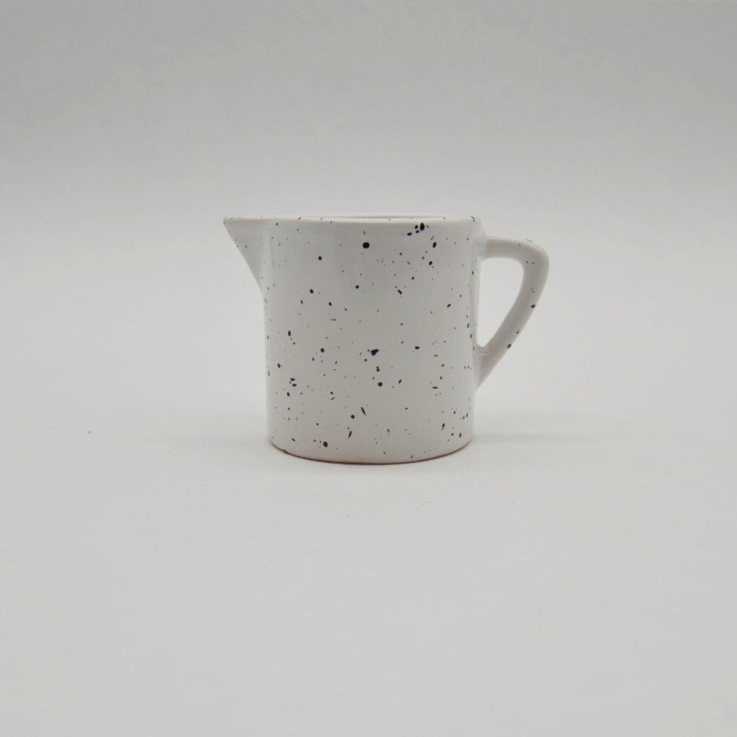 Vintage jug by Asa white/black speckled