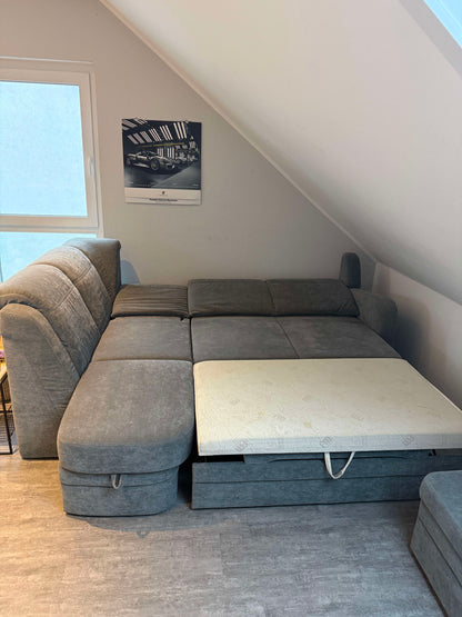 Ecksofa mit Schlaffunktion und Bettkasten von Oelsa in Grau Pre-Loved