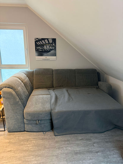 Ecksofa mit Schlaffunktion und Bettkasten von Oelsa in Grau Pre-Loved