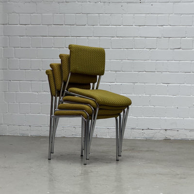 Vintage dining chair with chrome frame and textured mustard-colored upholstery fabric