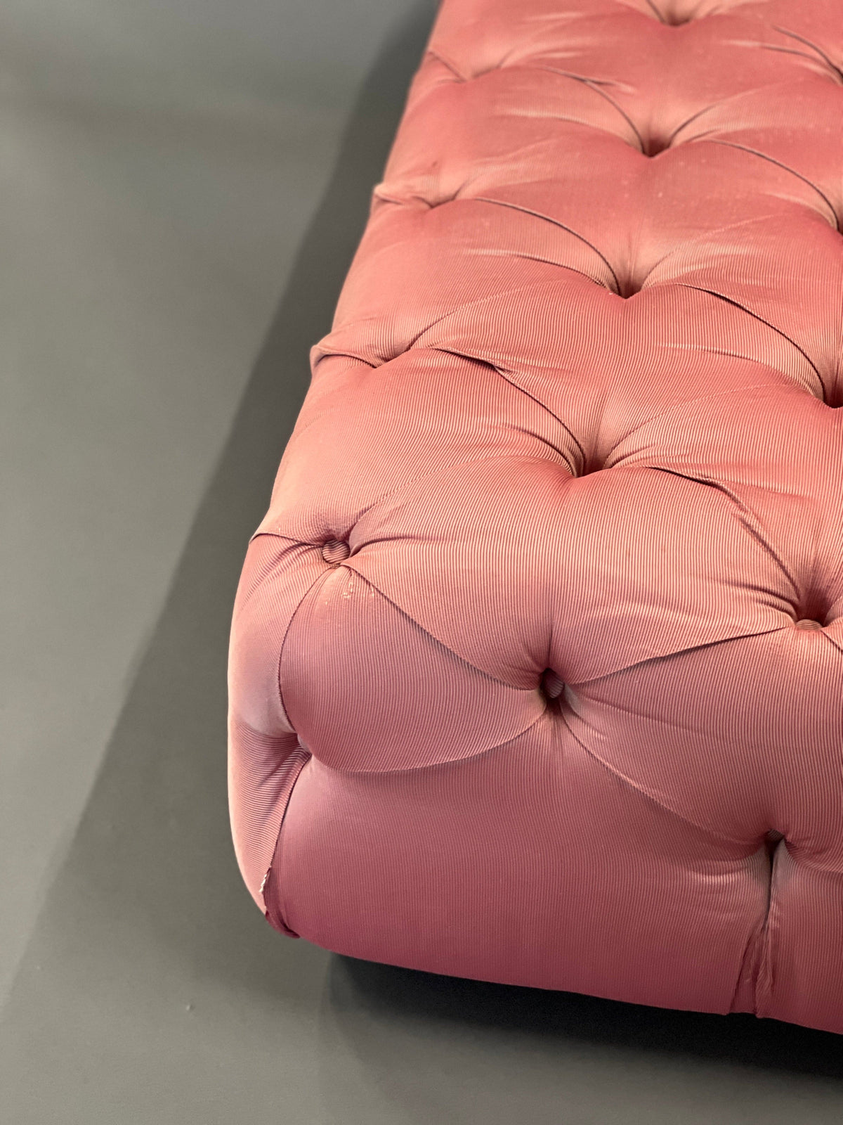 Pouf / Ottoman made of pink fabric