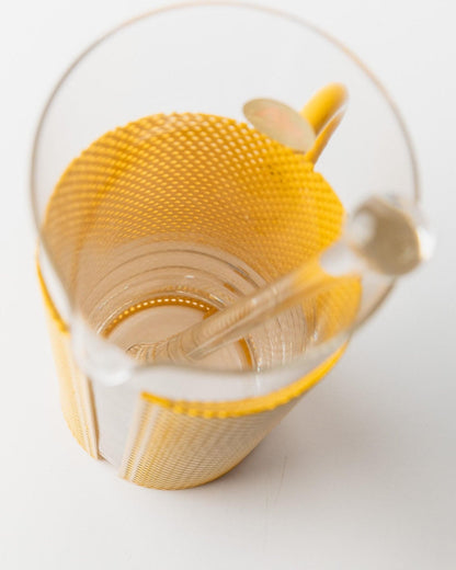 Vintage glass jug with yellow metal handle and glass pestle by De Agostini Memphis style 80s